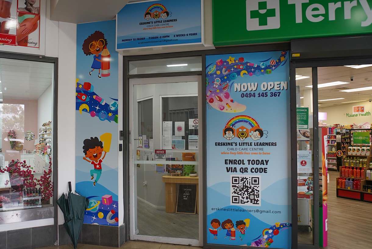 The centre's shopfront entrance, with rainbow signage and glass doors, inside the Swallow Drive shops.